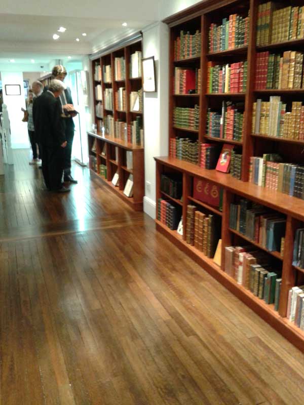 A second matching mahogany bookshelving unit